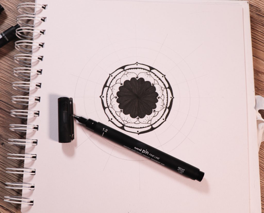 Draw a rosette-style mandala